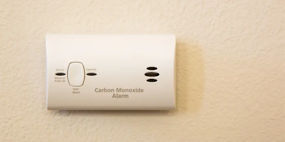 Should a carbon monoxide alarm be placed high or low?